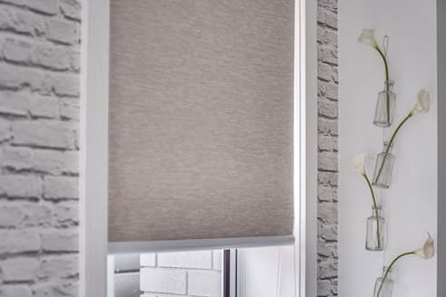 Sunscreen roller blinds hung in recess